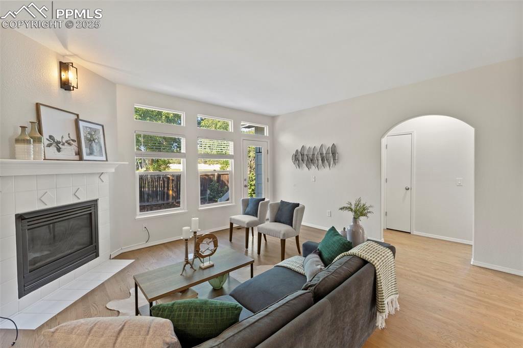 Image 12 of 39: Cozy and comfortable, the living room centers around a gas fireplace and na