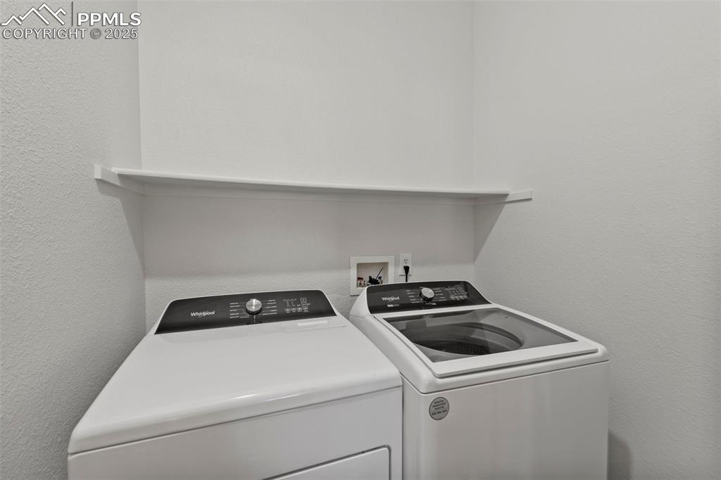 Image 22 of 39: With electric hook-ups and a main-level location, the laundry area adds eas