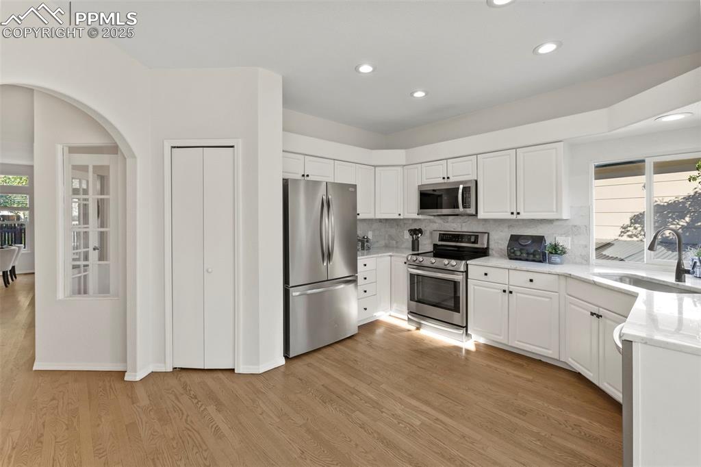 Image 3 of 39: Warm and efficient, the kitchen offers everything you need—plenty of prep s