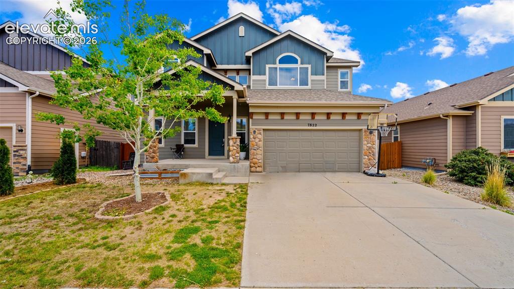 Image 1 of 41: Attractive 2 Story with finished waslk out basement, a three-car tandem gar