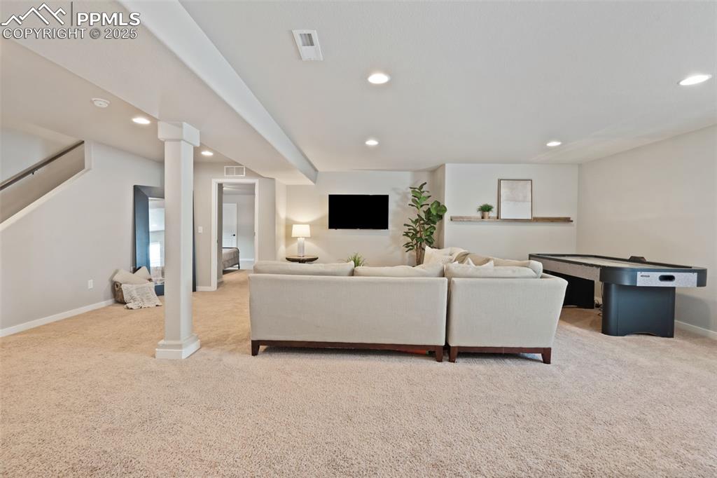 Image 18 of 28: Lots of Room to Host in This Large Basement