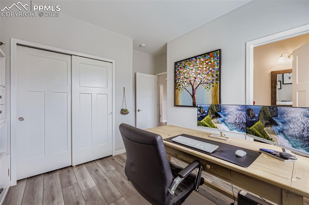 Image 27 of 50: Office featuring light wood-style flooring