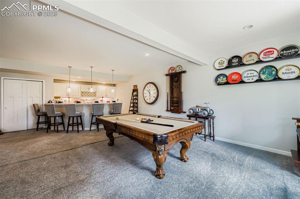 Image 32 of 50: Game room featuring beamed ceiling, billiards table, recessed lighting, dar