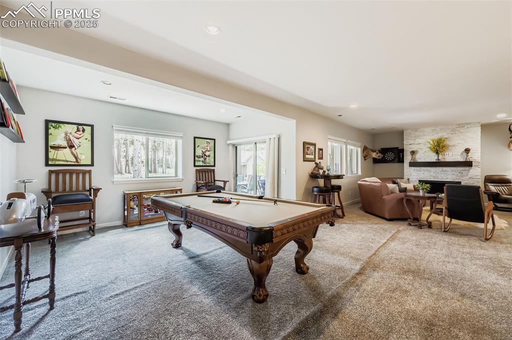 Image 33 of 50: Game room featuring pool table, carpet flooring, recessed lighting, and a f