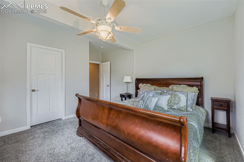 Image 42 of 50: Bedroom featuring carpet flooring and ceiling fan