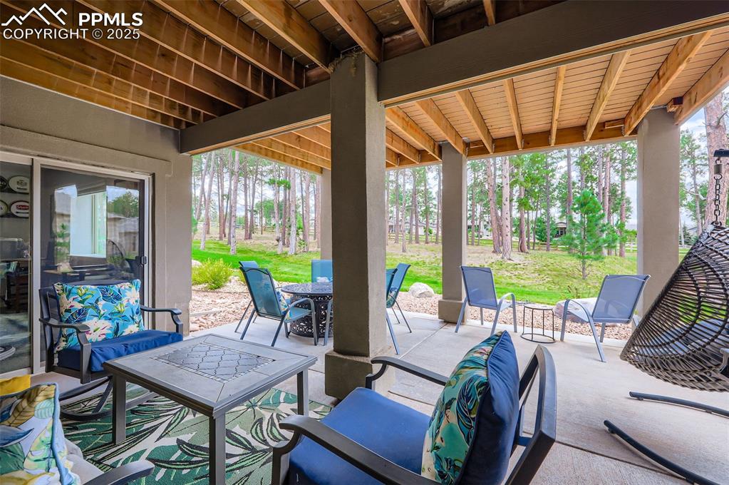 Image 49 of 50: View of patio featuring outdoor dining area