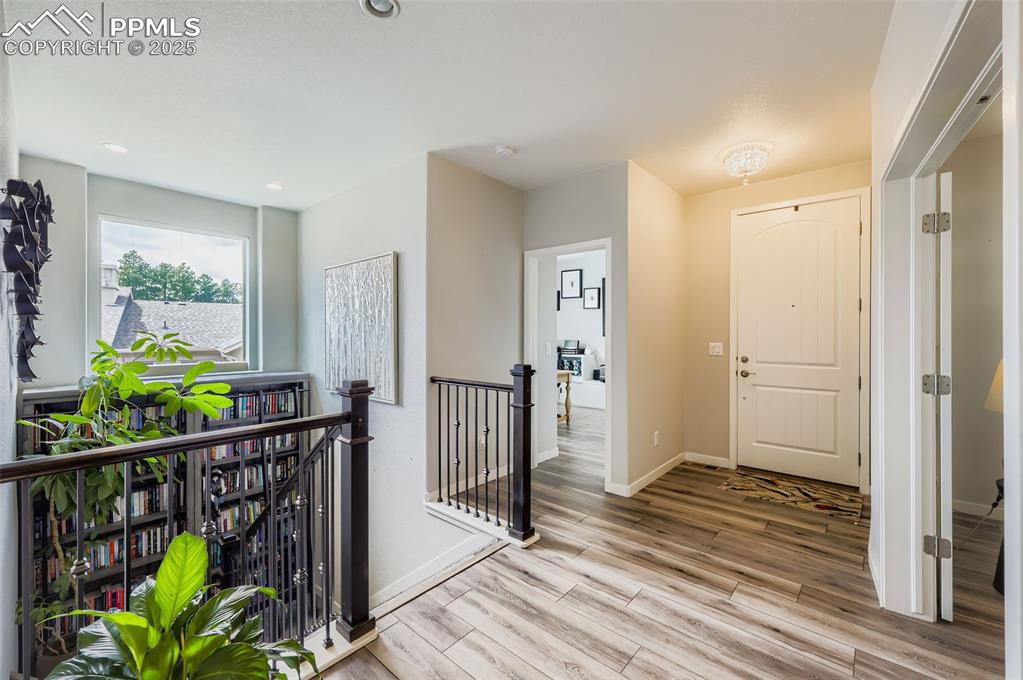 Image 6 of 50: Entryway featuring light wood-type flooring and recessed lighting
