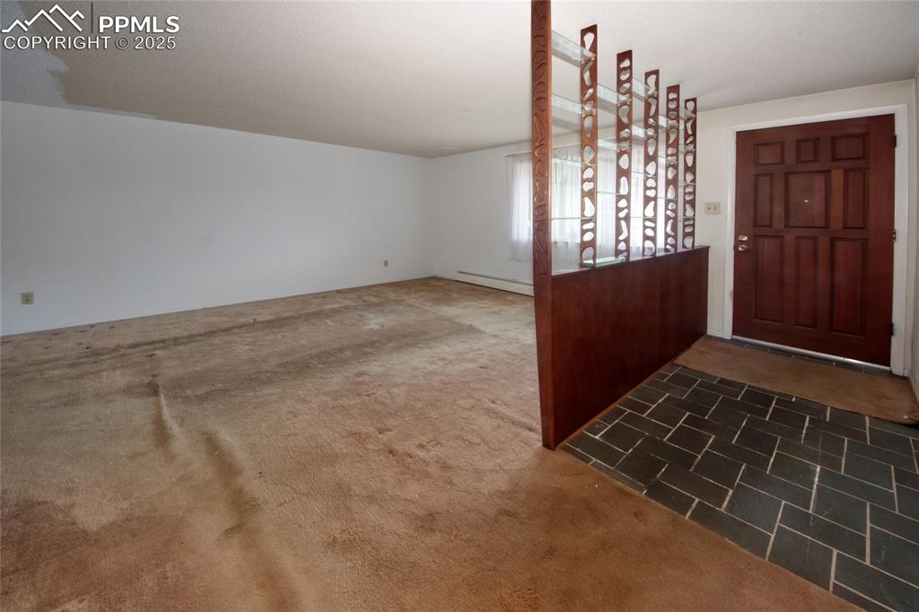 Image 3 of 37: Carpeted entryway featuring baseboard heating