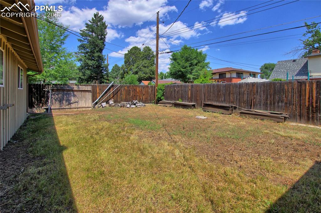 Image 32 of 37: View of fenced backyard