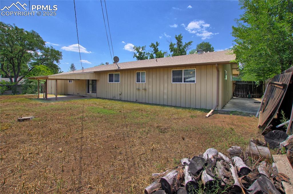 Image 34 of 37: Back of property featuring a patio area and roof with shingles