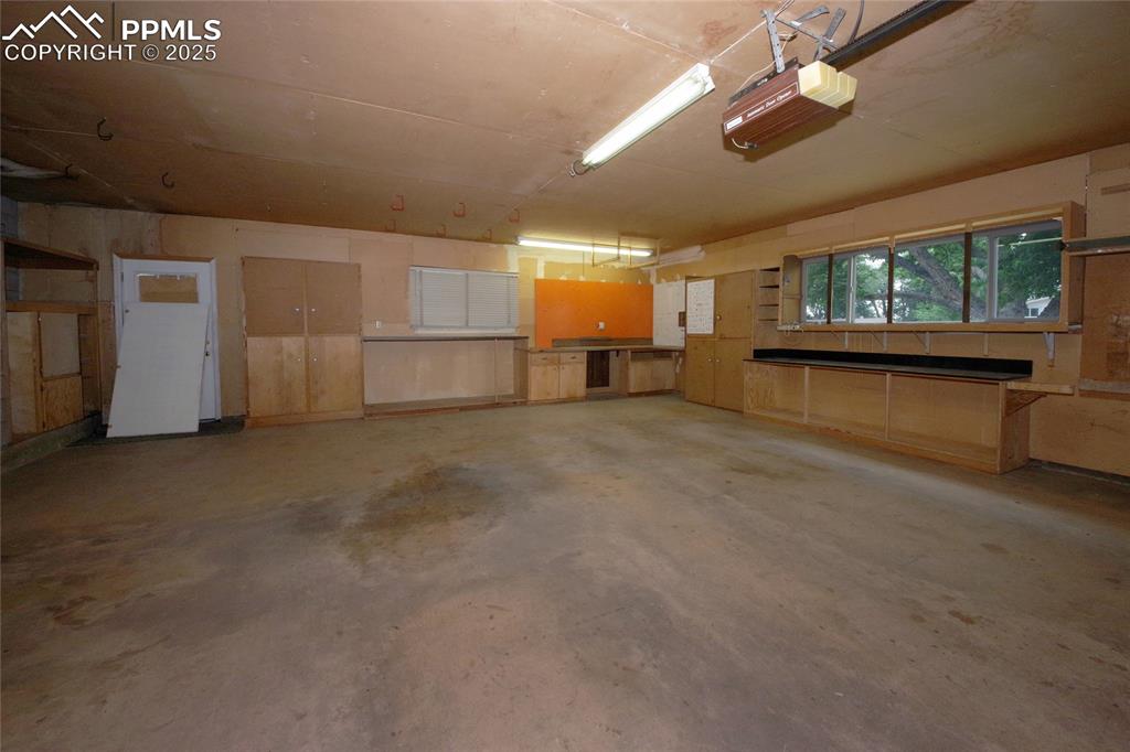 Image 36 of 37: Garage with a garage door opener