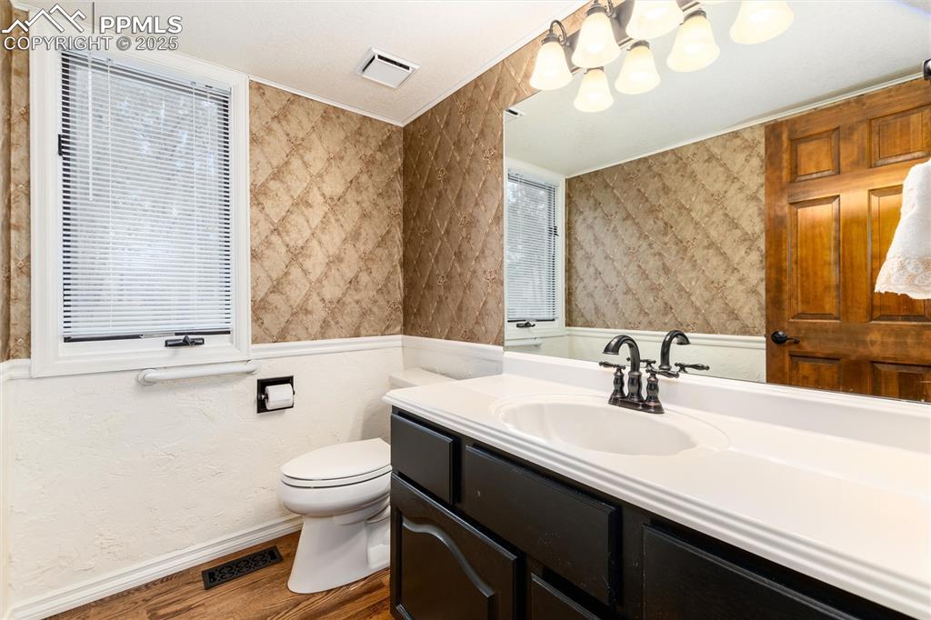Image 18 of 41: Main floor half bathroom