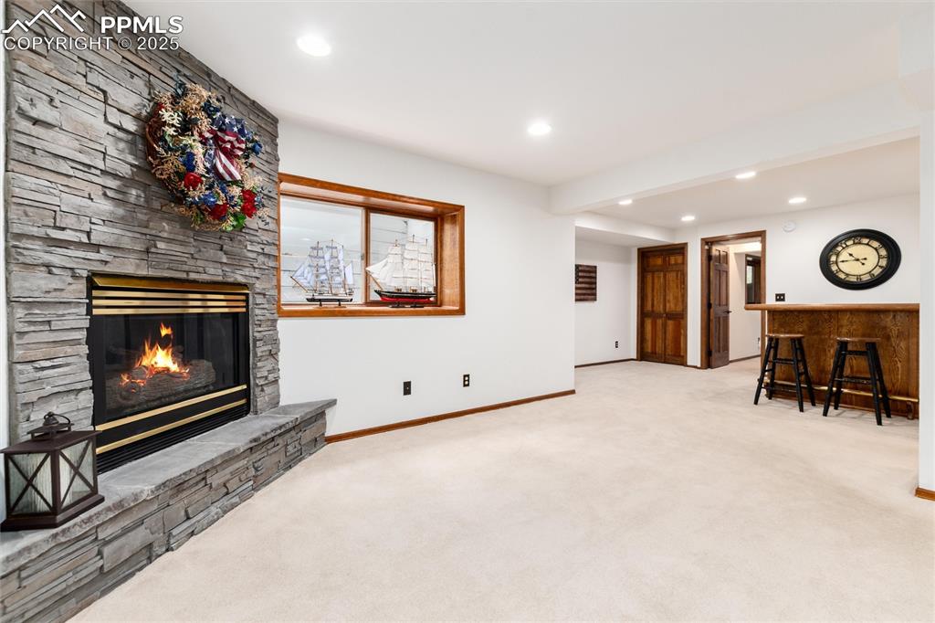 Image 28 of 41: Gas fireplace in basement