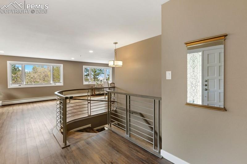 Image 3 of 47: Large entry with unique custom railing!