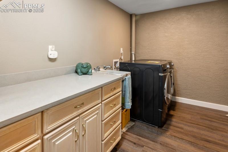 Image 36 of 47: large laundry room with additional storage!