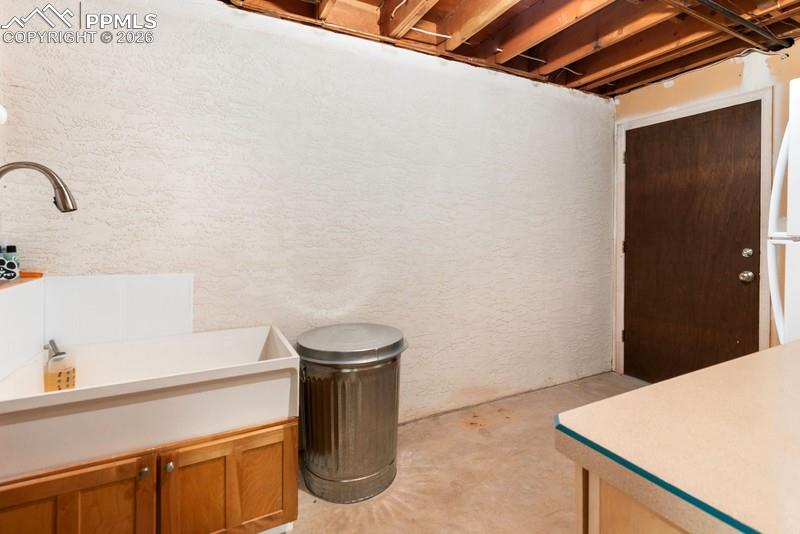 Image 38 of 47: Dog washing station in storage room