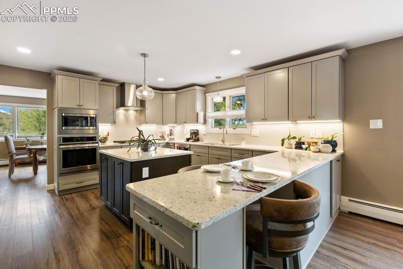 Image 4 of 47: Newer custom kitchen with quartz counter tops, island