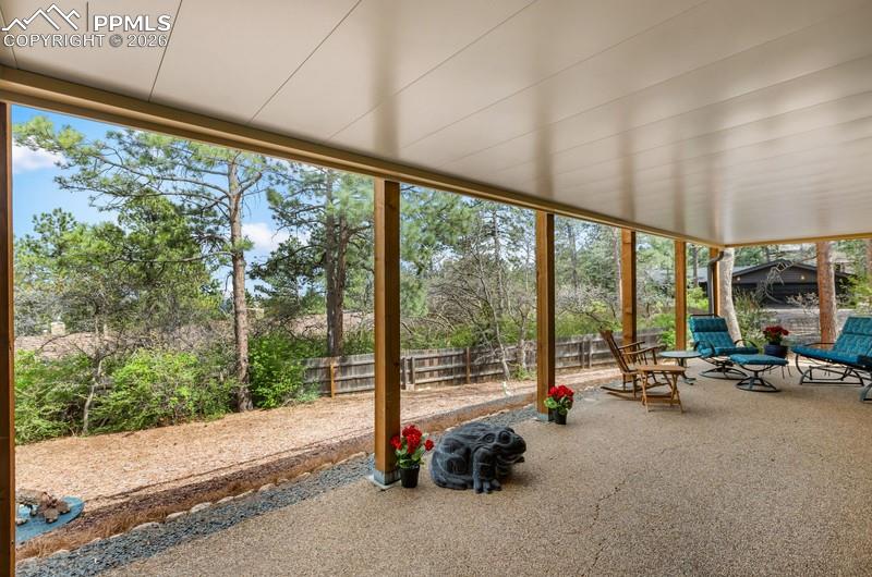 Image 40 of 47: Covered patio the full length of the home!
