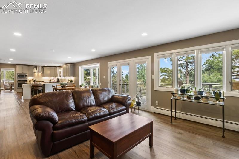 Image 9 of 47: family room and kitchen walks out to awesome TREX deck!