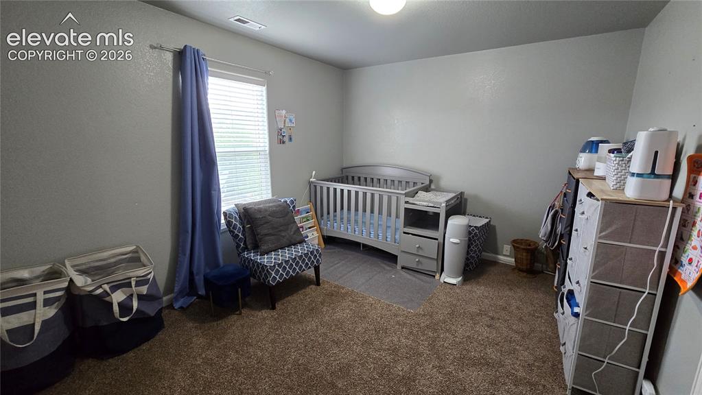 Image 17 of 21: Bedroom 2 on upper level