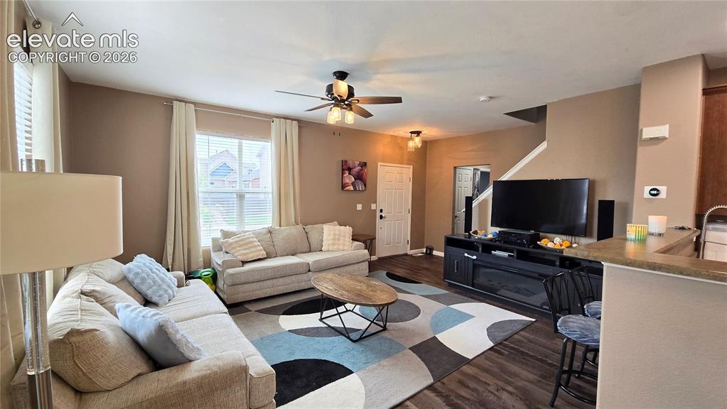 Image 4 of 21: Entry and living room area, stairs to upper level