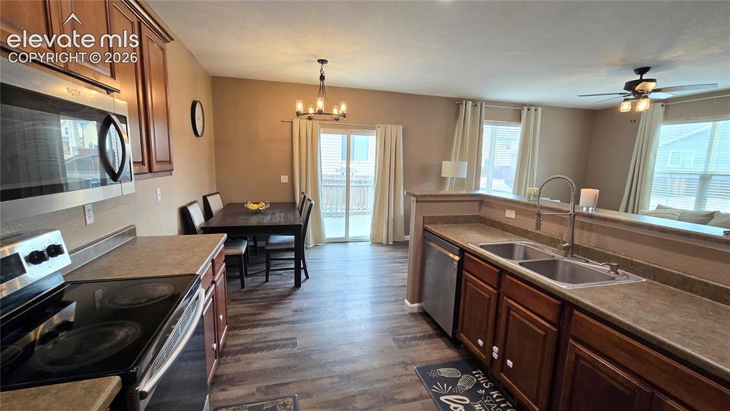 Image 7 of 21: Kitchen and dining area, walk out to backyard