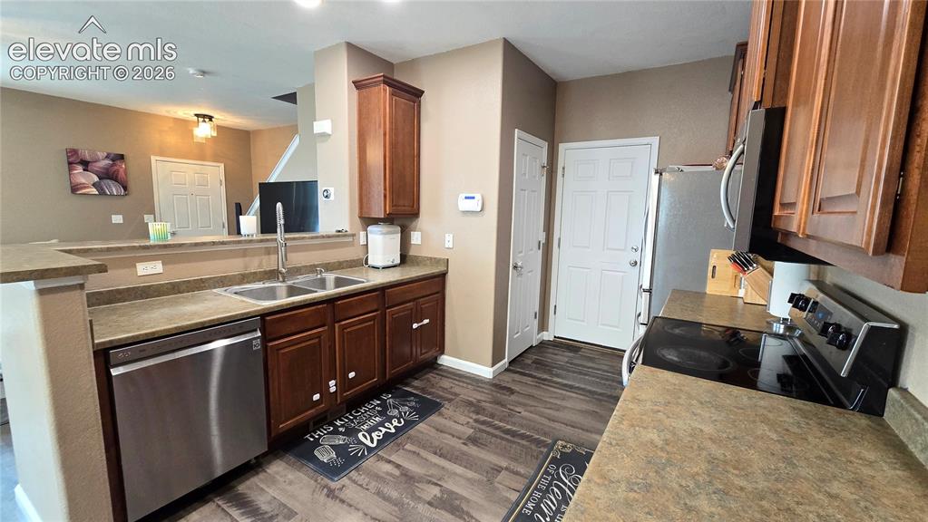 Image 8 of 21: Kitchen with pantry and walk out to garage