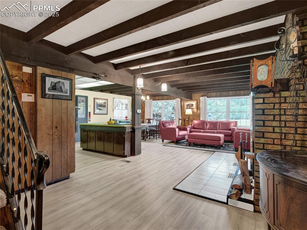 Image 3 of 43: Nice and open, if someone is cooking in the kitchen, they are still a part 