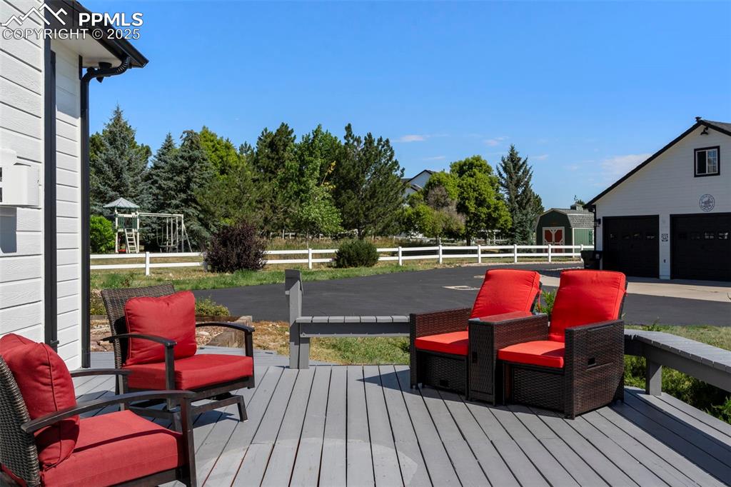Image 37 of 50: Additional seating area on the deck.
