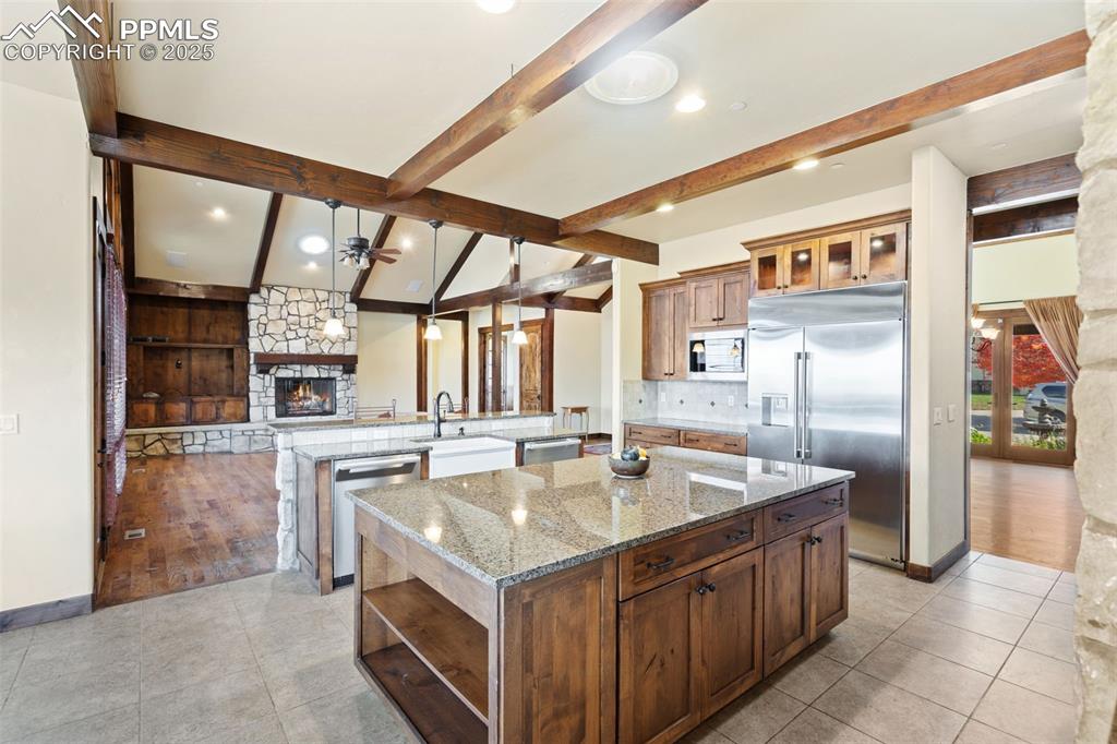 Image 12 of 50: The kitchen adjoins the great room. Note the 2 new Miele dishwashers on eac
