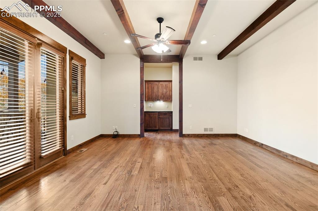 Image 22 of 50: The primary suite includes a coffee bar equipped with under cabinet lightin