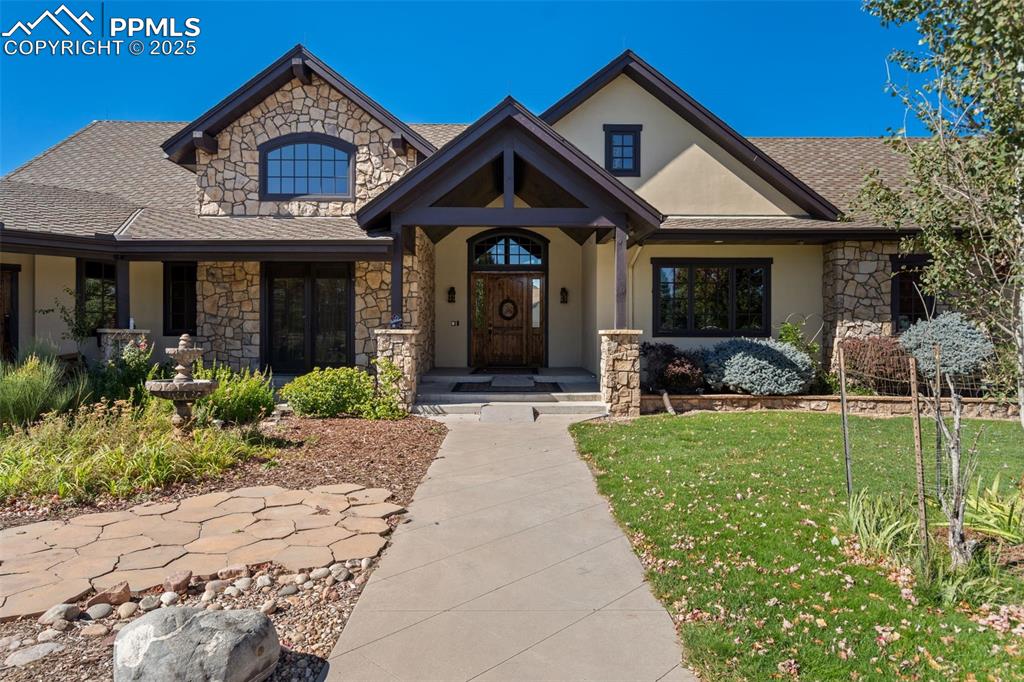 Image 3 of 50: Welcome Home! The beautiful entrance greets all with Colorado charm.