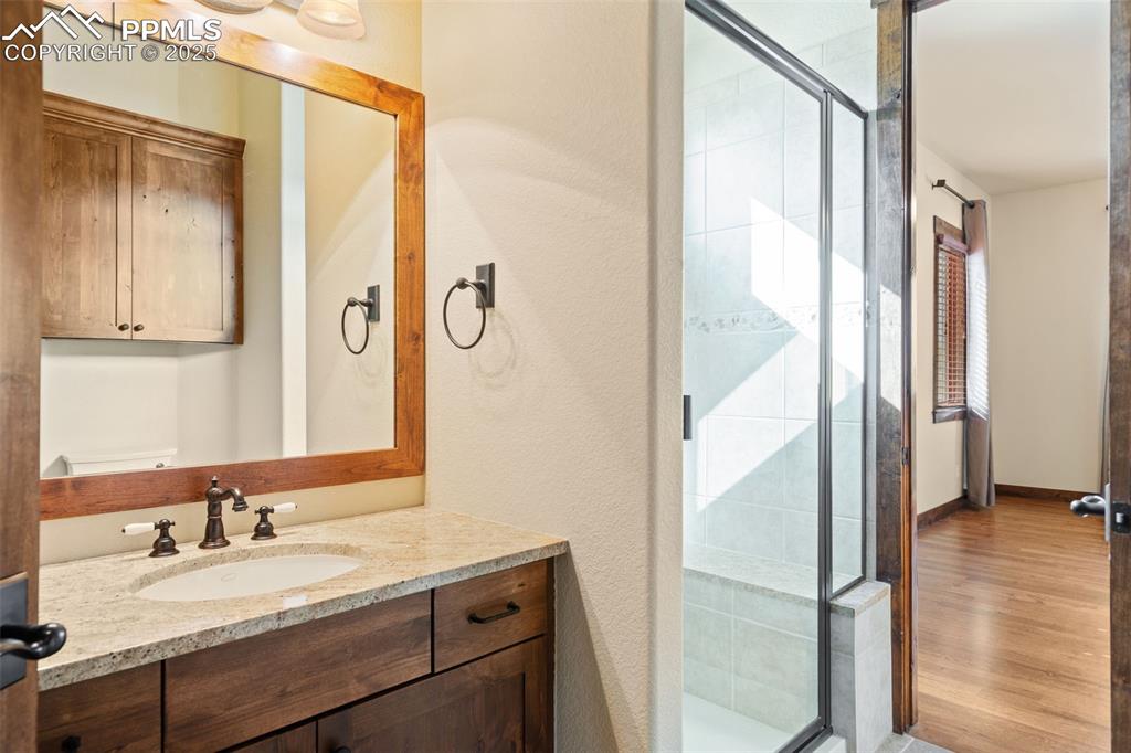 Image 34 of 50: En-suite 3/4 bath adjoins bedroom 2 on the main level.