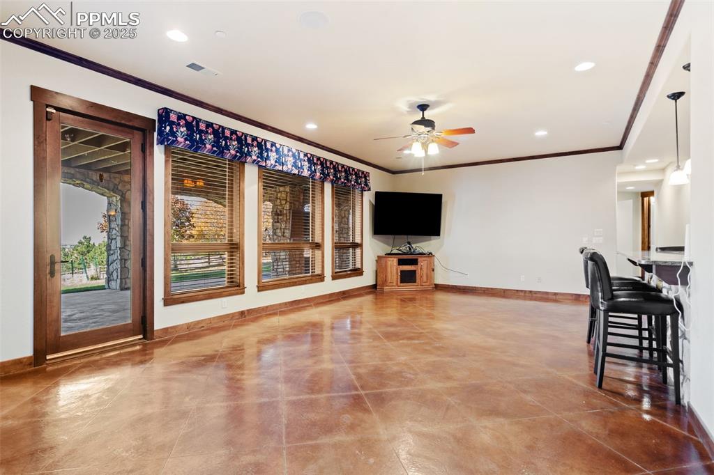 Image 38 of 50: The walk-out basement family room is the perfect place for get-togethers wi