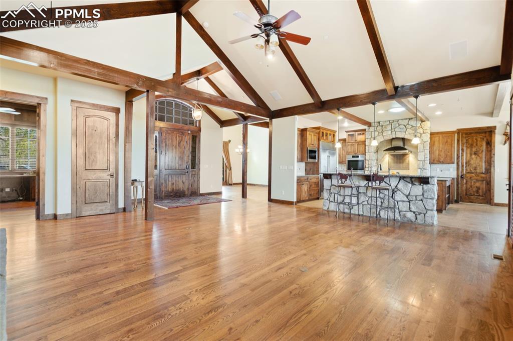 Image 8 of 50: An expansive view of the open living area greets you as you enter the home.