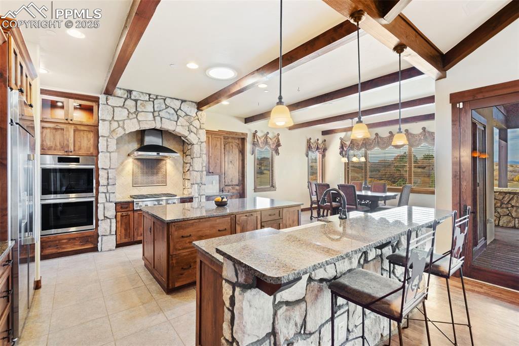 Image 9 of 50: Picture yourself enjoying family time in the awesome gourmet kitchen while