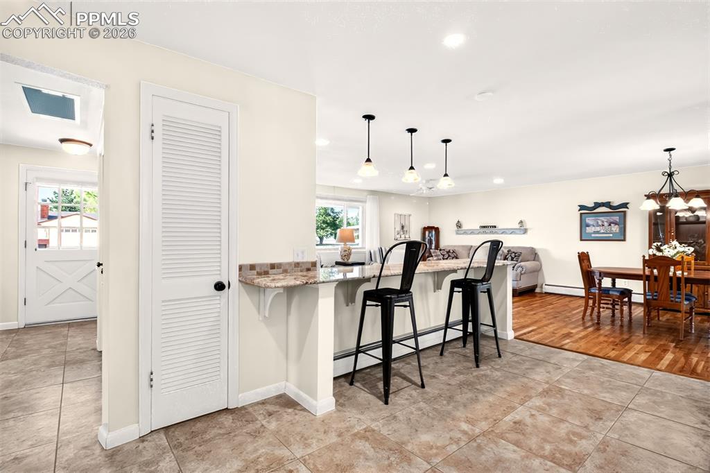 Image 11 of 39: Breakfast Bar, Spacious Walk-Through Kitchen.