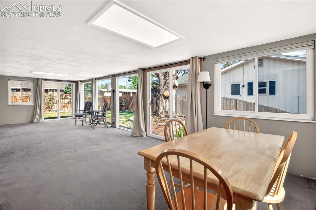 Image 21 of 39: 32x12 Sun Room, Two Sliding Doors, Tiered Yard.