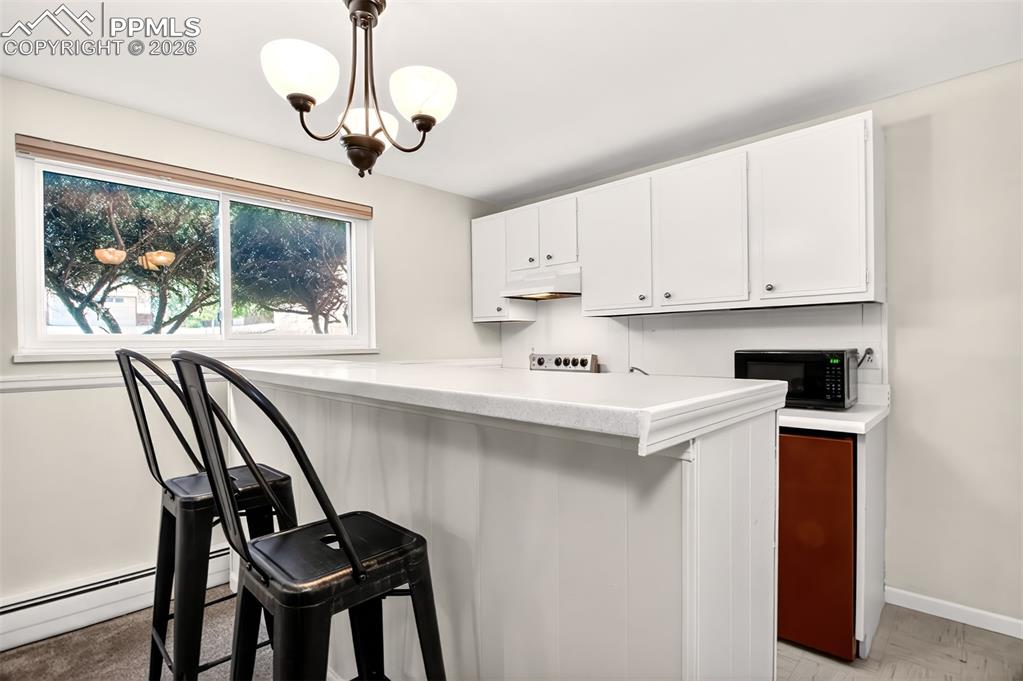 Image 23 of 39: Refrigerator and Stove, Quartz Counter