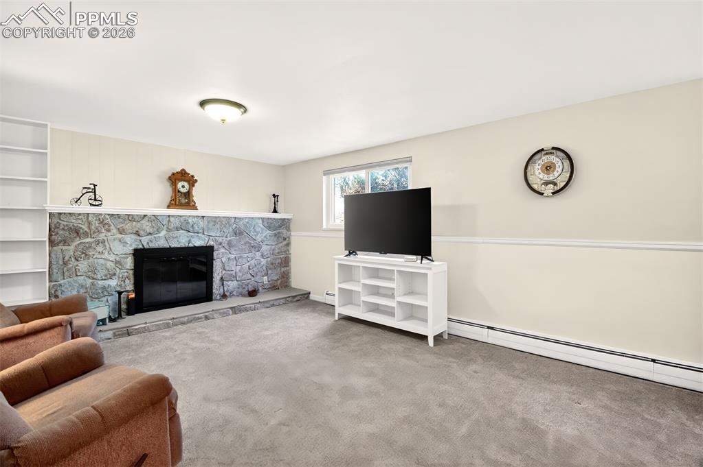 Image 25 of 39: Basement Living Room, Gas-Log Fireplace