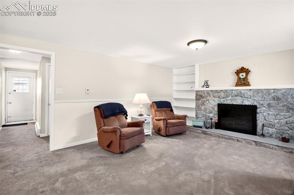 Image 26 of 39: Large Family Room, Built-In Shelves, Walk-Out To Private Yard