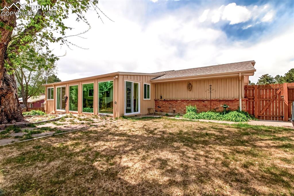 Image 30 of 39: Walk Out From The Sunroom Room To The Upper Level Yard