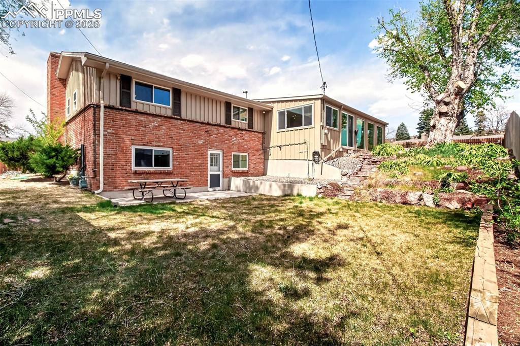 Image 31 of 39: Lower level Yard And Patio, Fully Landscaped