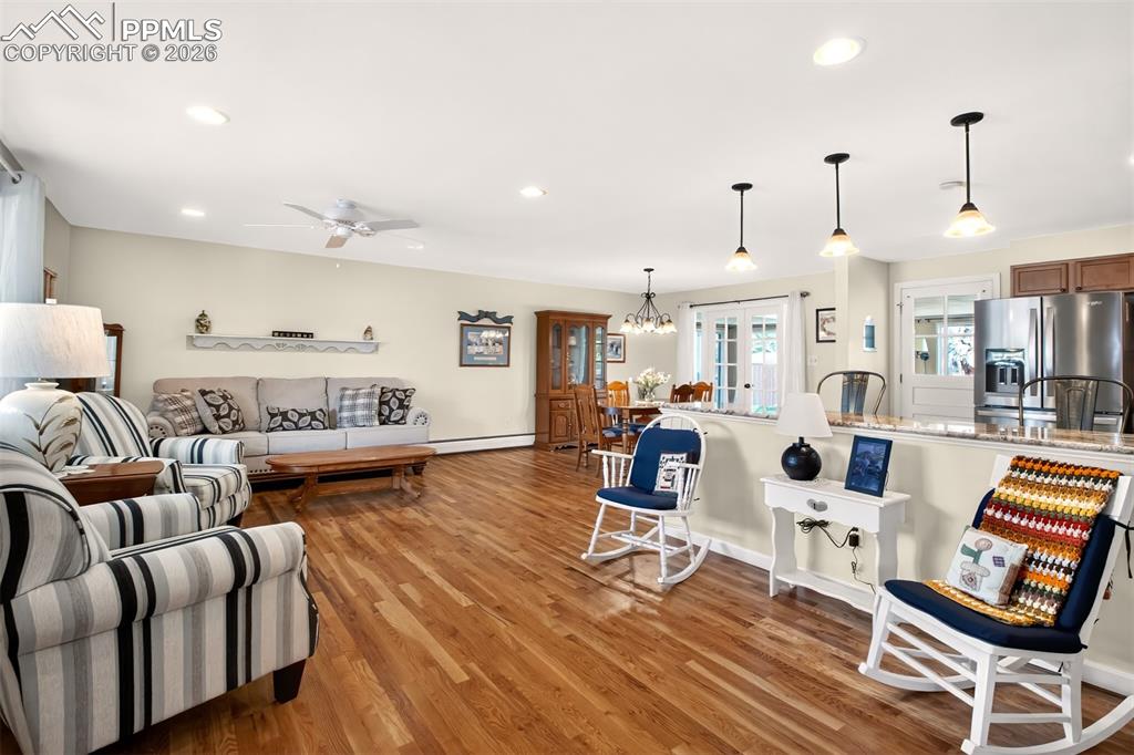 Image 5 of 39: Open Floor Plan With Gorgeous Hardwood Flooring