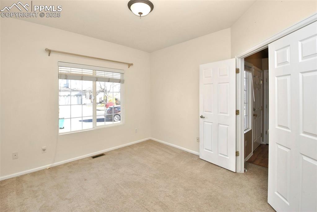 Image 17 of 27: Unfurnished bedroom featuring light colored carpet and baseboards