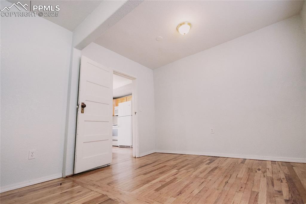 Image 13 of 46: Bedroom, natural light, wood finished floors, ceiling fan,