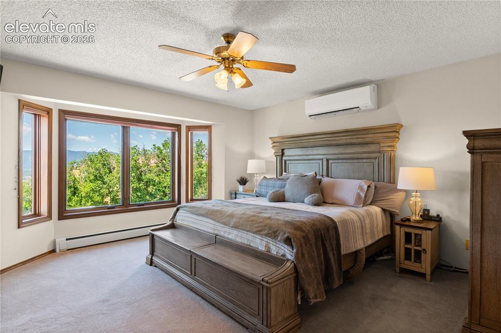 Image 15 of 30: Main level master suite, again with views and privacy.