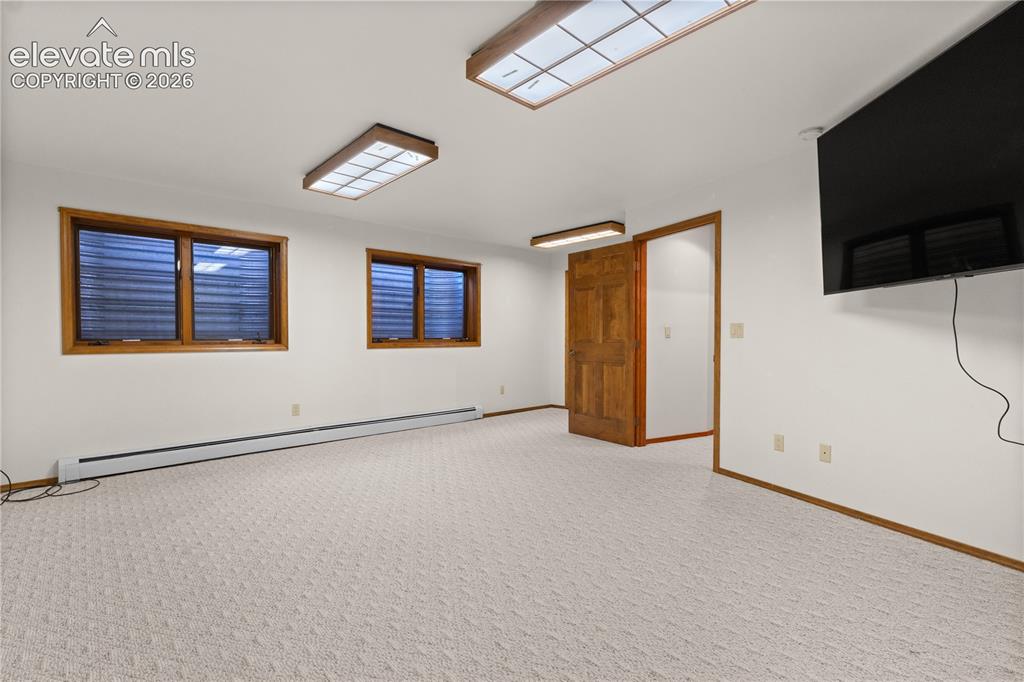 Image 24 of 30: Rec or game room - perfect place to roam or have hobbies.