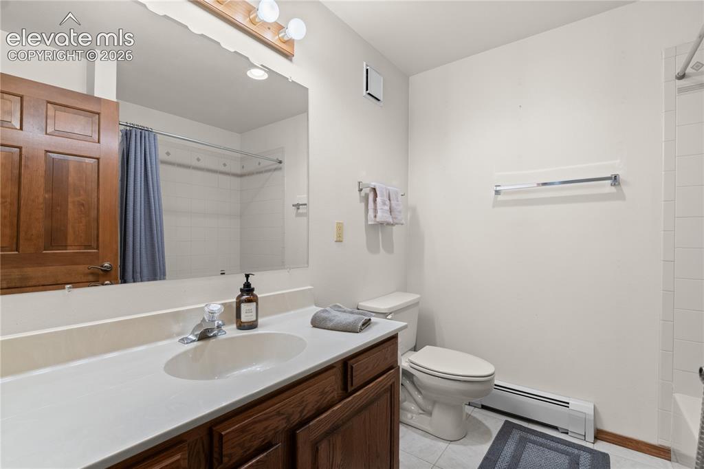 Image 26 of 30: Full basement bathroom.
