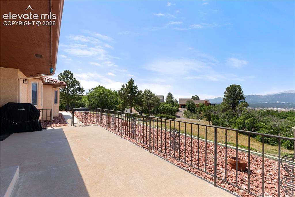 Image 27 of 30: This front Porch is a show stopper. Sunset views all year round.